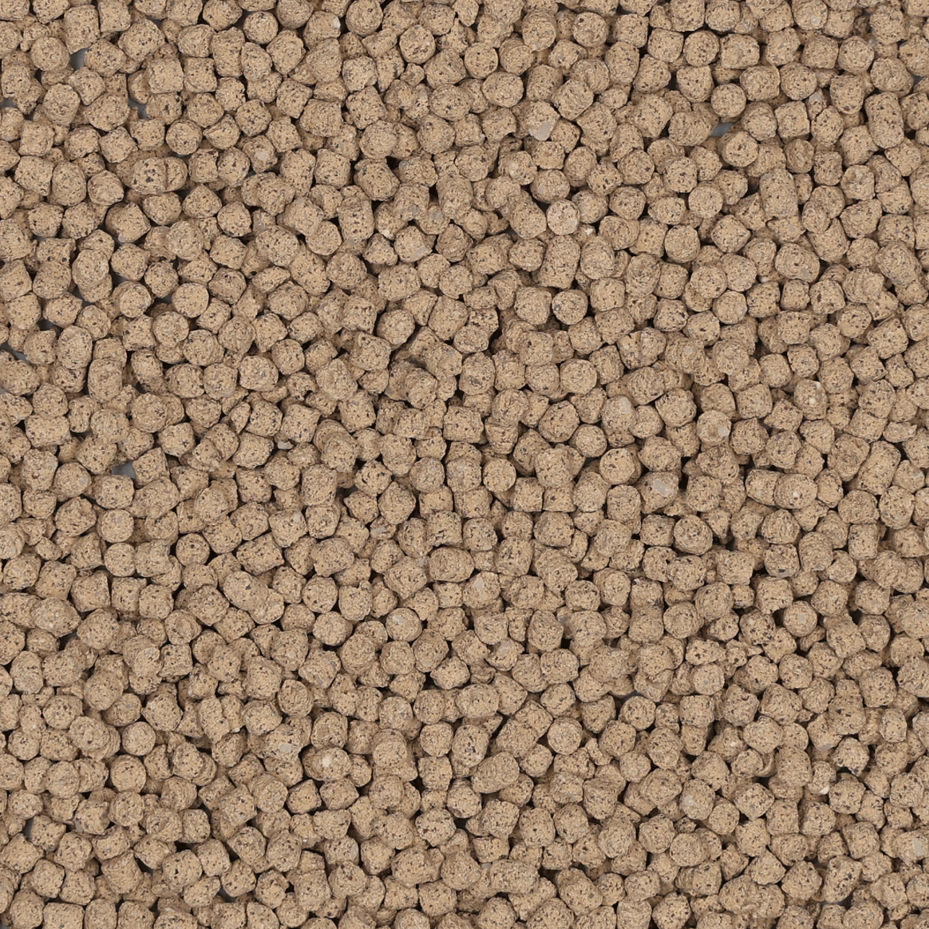 Detailansicht von Manna Spezial Gartendünger, gleichmäßige beige-braune Granulatkörner für Zier- und Nutzpflanzen, sorgt für eine kontinuierliche Nährstoffversorgung. Detailansicht von Manna Spezial Gartendünger, gleichmäßige beige-braune Granulatkörner für Zier- und Nutzpflanzen, sorgt für eine kontinuierliche Nährstoffversorgung.